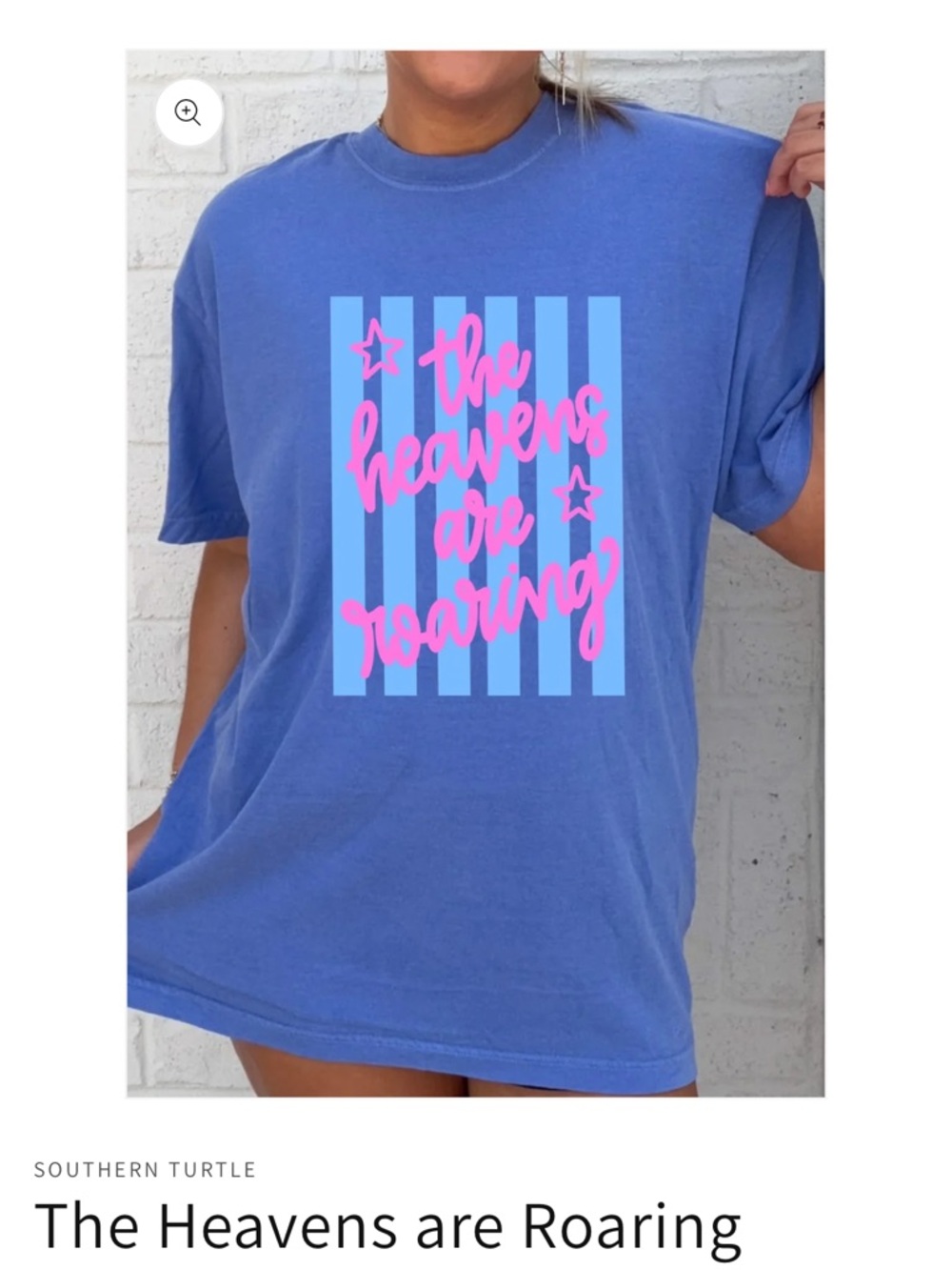 Blue Graphic Tee with Pink Script 'The Heavens Are Roaring'